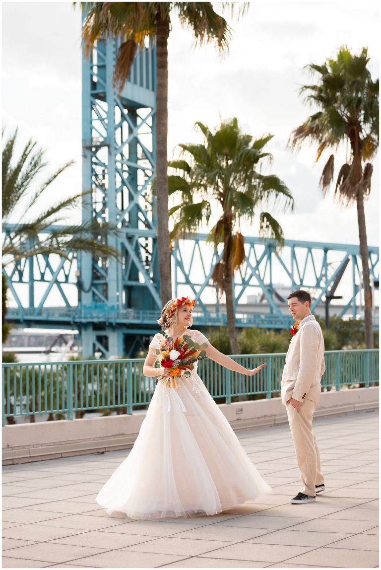 Bride and Groom at HYATT REGENCY Jacksonville with Bridge behind