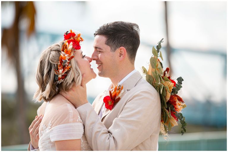 Portrait of Bride and Groom with fall florals